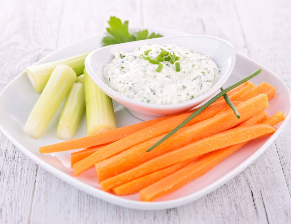 Carrot and celery sticks with homemade dip -cheap healthy snack.