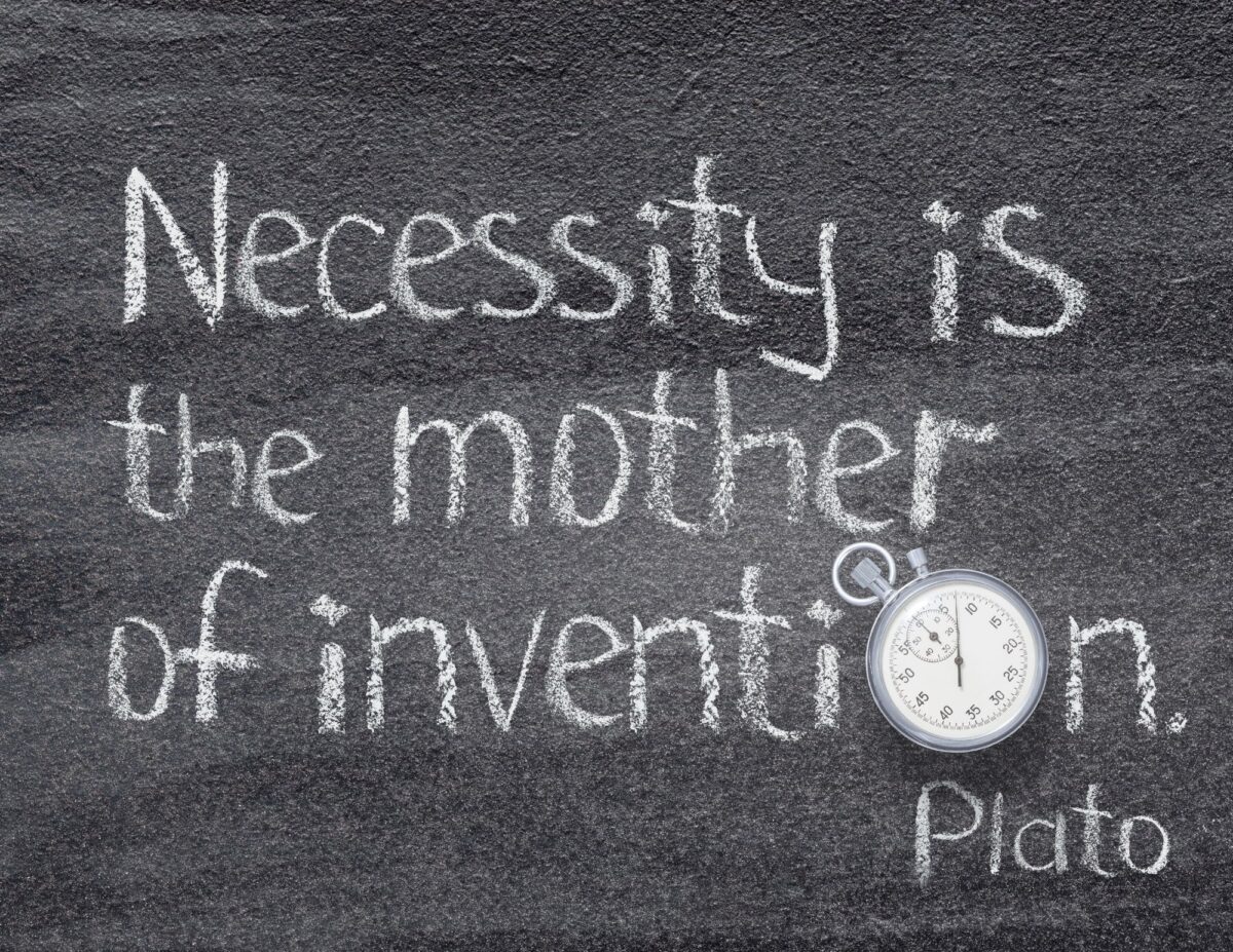 A chalkboard with the phrase, by Plato, "Necessity is the Mother of Invention", written on it - frugal tips from the Great Depression.