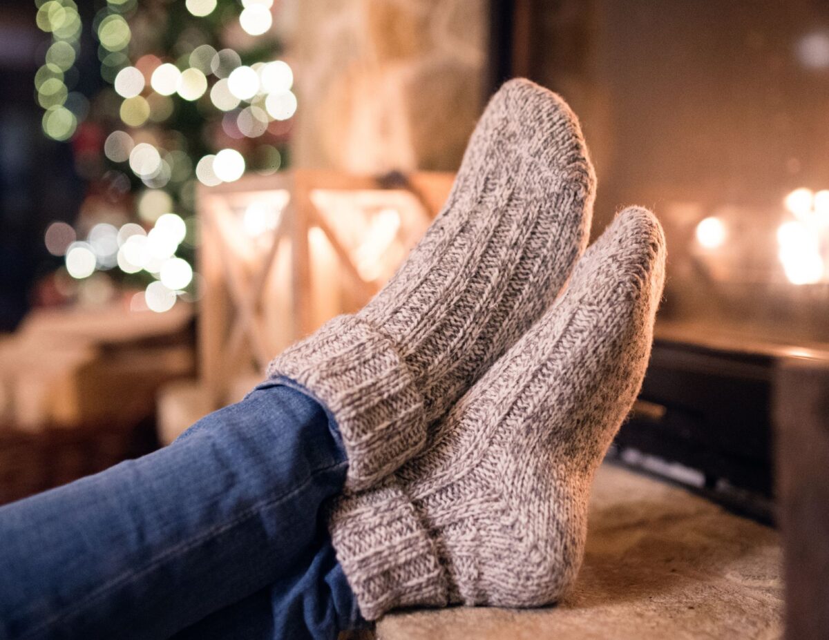 someone's feet with socks on - frugal gifts for Christmas.