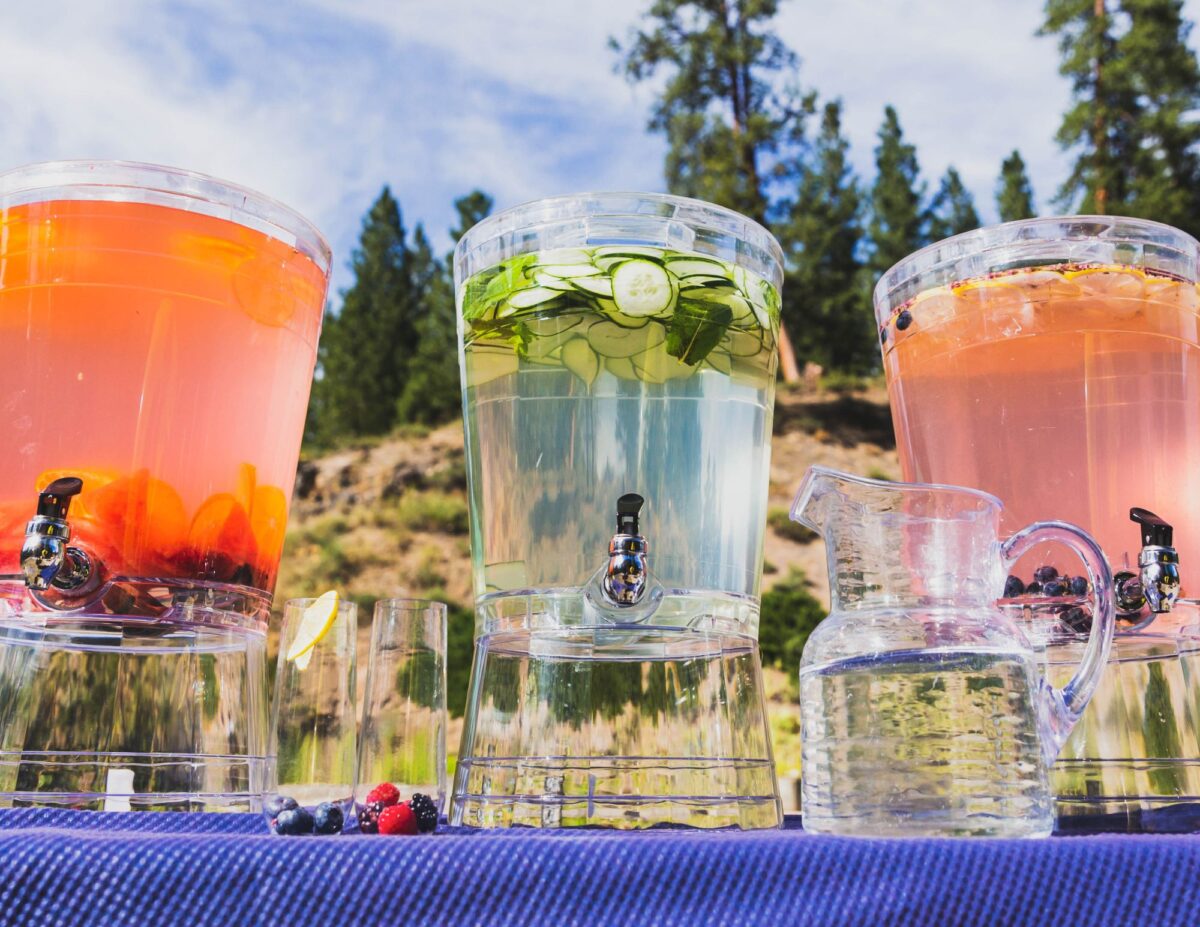 3 large dispenser of infused water - cheap baby shower food ideas.