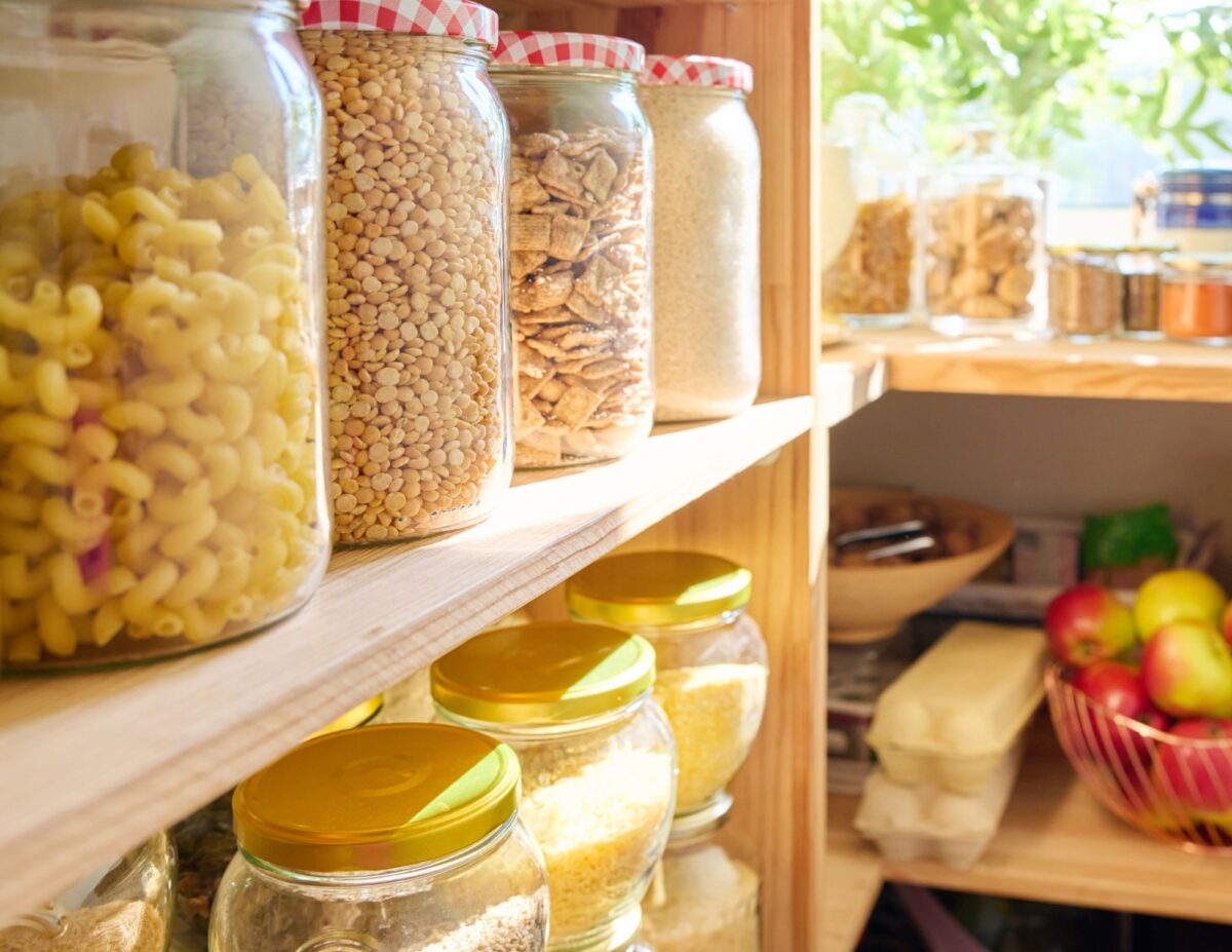 a pantry with jars of grains, tomatoes, and eggs - easy cheap lunch ideas.
