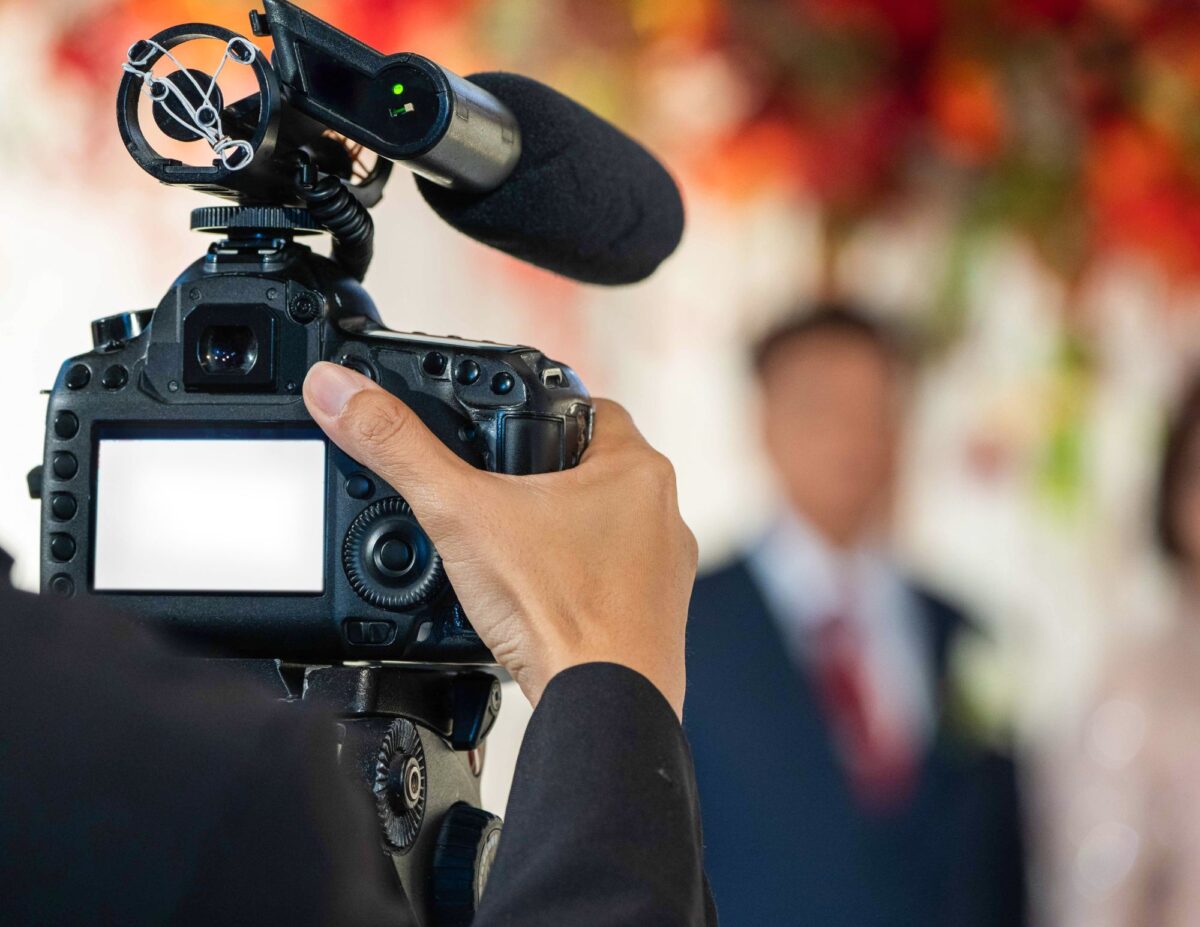 someone is videoing - outdoor wedding ideas on a budget