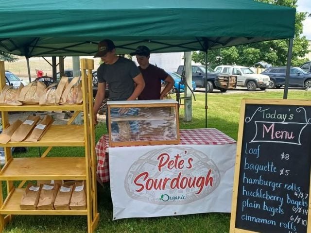 a teen organic sourdough stand at a farmer's market