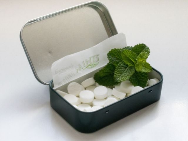 a tin of mints with a mint leaf - baby shower favors