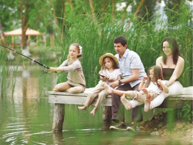 a family is fishing - family traditons