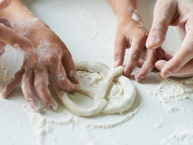 someone is making a pretzel - family traditions